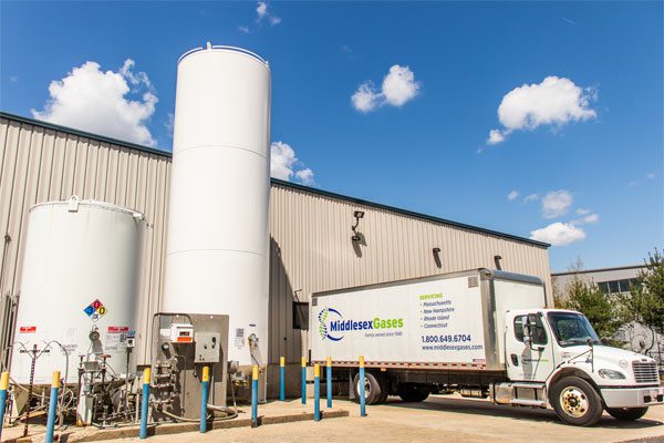 Image of the Middlesex Gases facility with a box truck outside